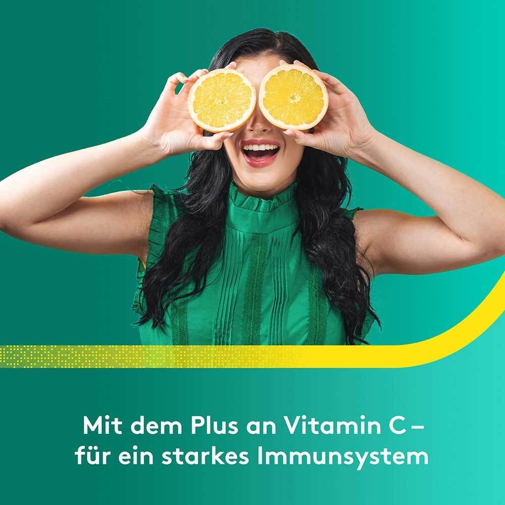 Frau mit Zitronen vor den Augen. Text: Mit dem Plus an Vitamin C - für ein starkes Immunsystem.