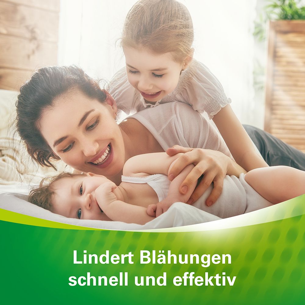 Mutter, Kind und Baby auf Bett. Text: Lindert Blähungen schnell und effektiv.