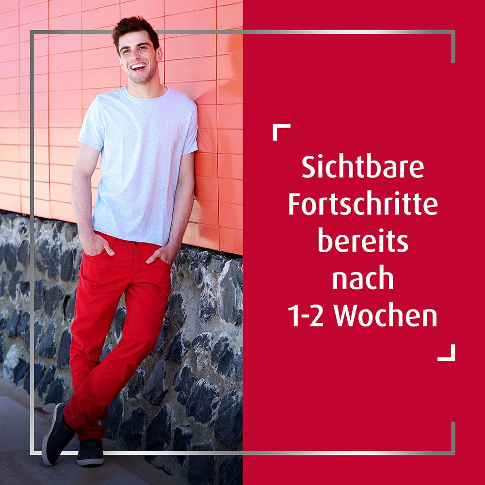 Mann steht an Wand. Text: Sichtbare Fortschritte bereits nach 1-2 Wochen.