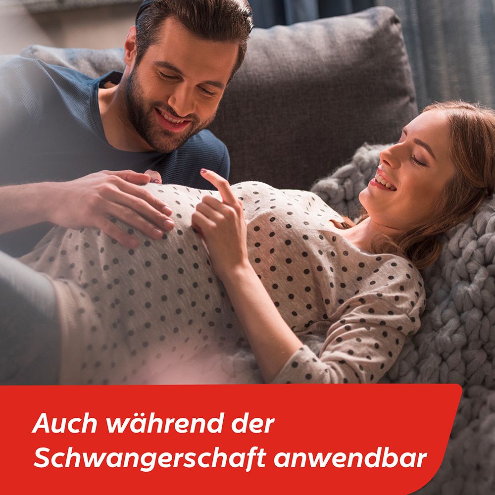 Paar im Bett, Frau schwanger. Text: Auch während der Schwangerschaft anwendbar.