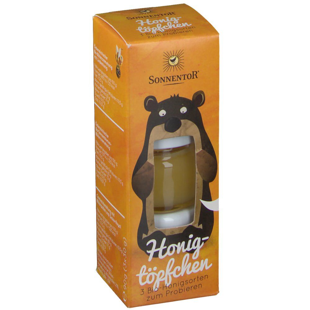 Verpackung mit Honigtöpfchen. SonnentoR Logo und Bär-Illustration. Text: Honigtöpfchen, 3 Bio-Honigsorten zum Probieren.