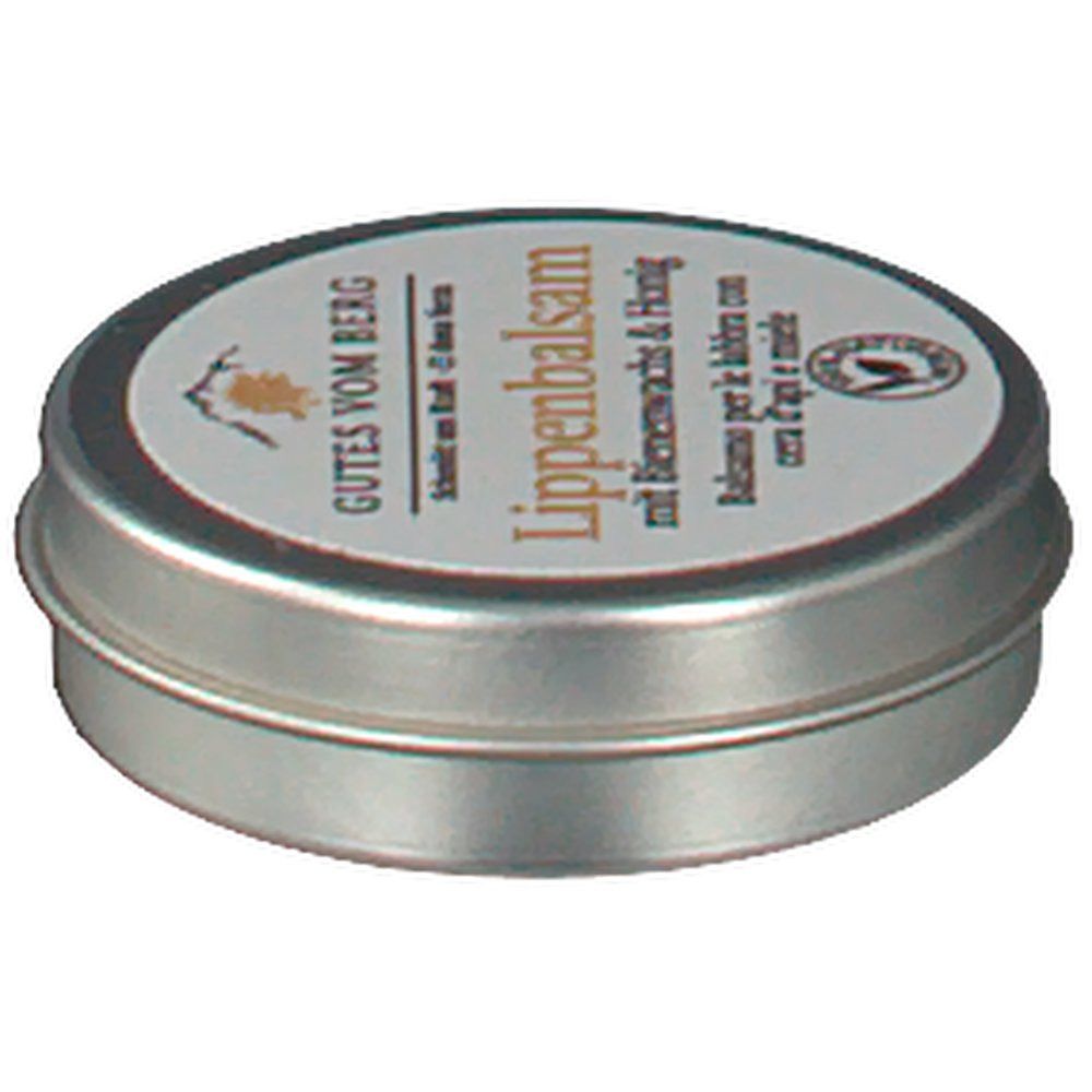 Runde Metallbox mit Deckel. Aufschrift: GUTES VOM BERG Lippenbalsam mit Bienenwachs & Honig. Siegel.