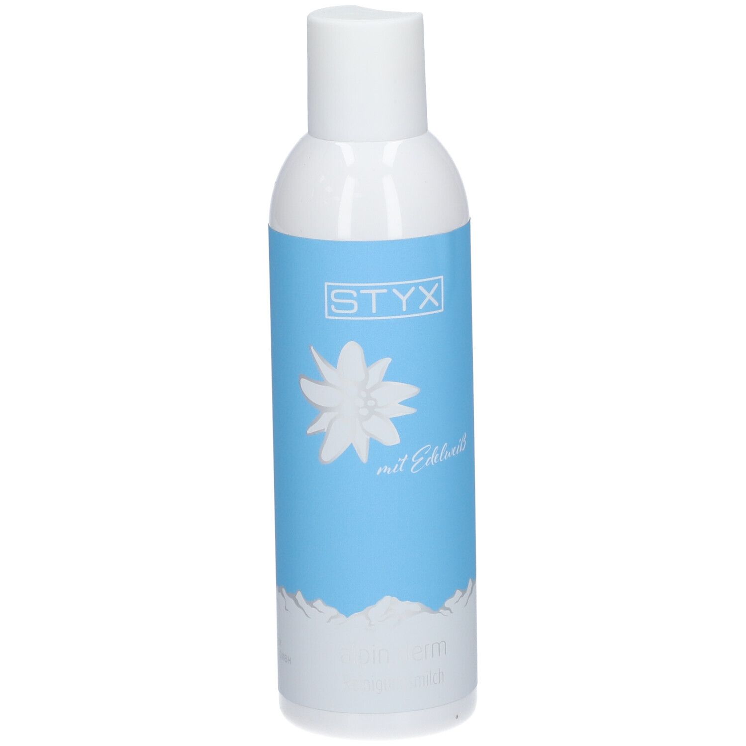 Weiße Flasche mit blauem Etikett. STYX-Logo, Edelweiß-Blume, Text: mit Edelweiß, alpin derm Reinigungsmilch.