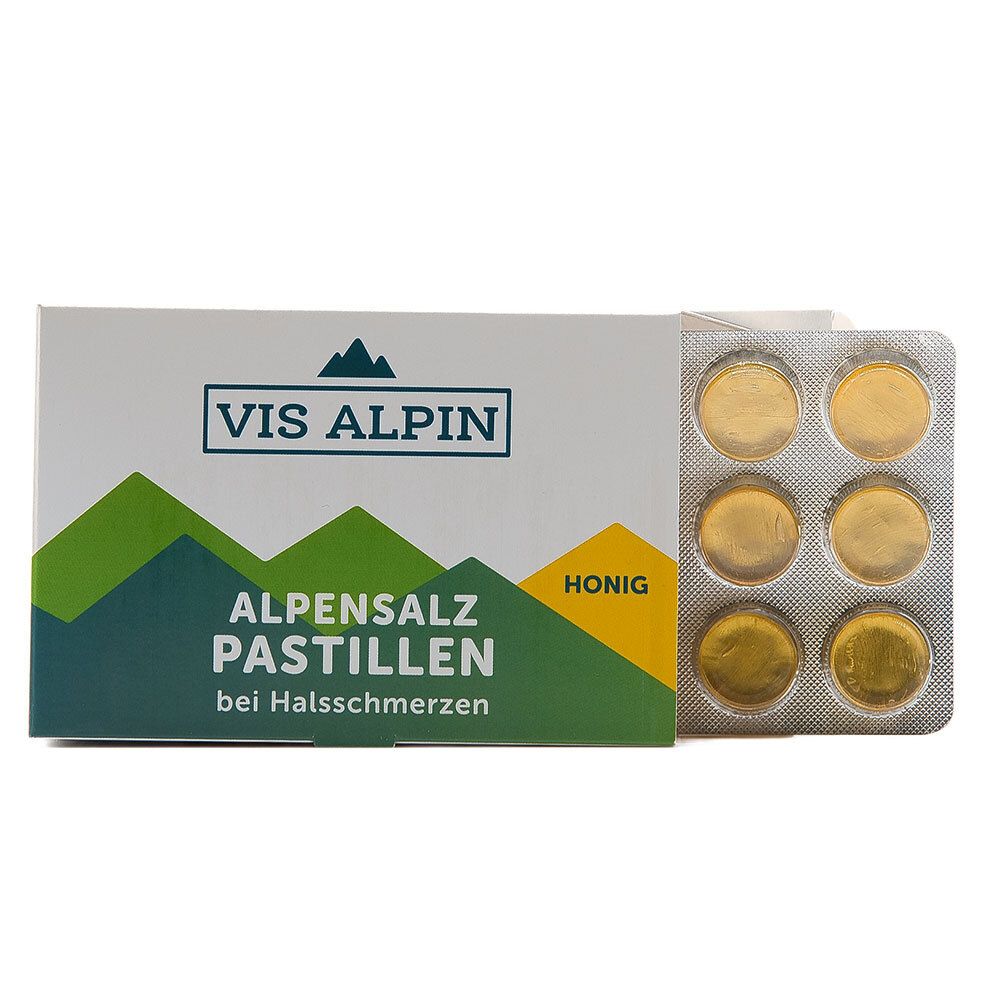 Geöffnete Packung mit VIS ALPIN. Karton mit Pastillen und Blister mit goldfarbenen Pastillen.