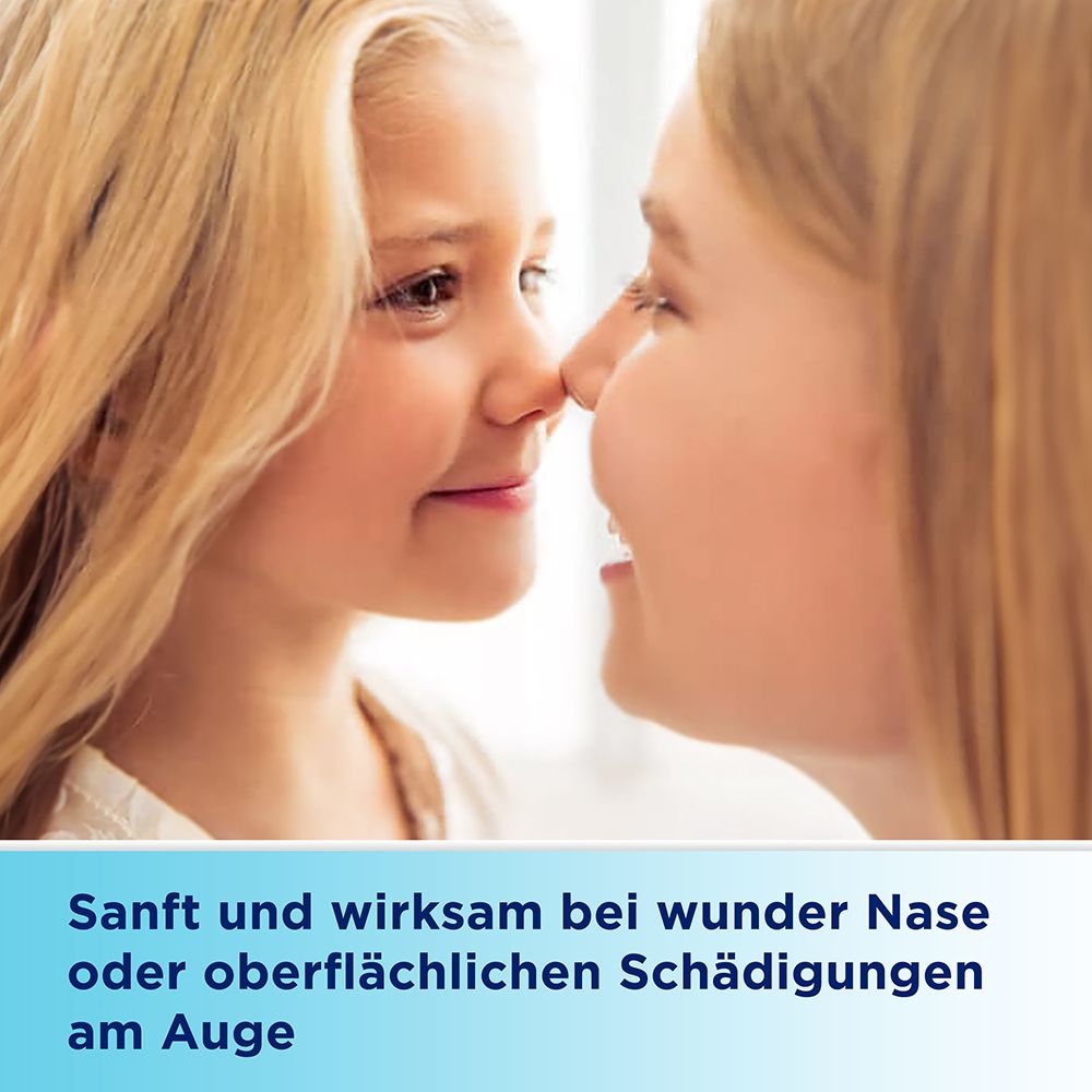 Zwei Personen berühren sich an der Nase. Text: Sanft und wirksam bei wunden Nasen oder oberflächlichen Schädigungen am Auge.