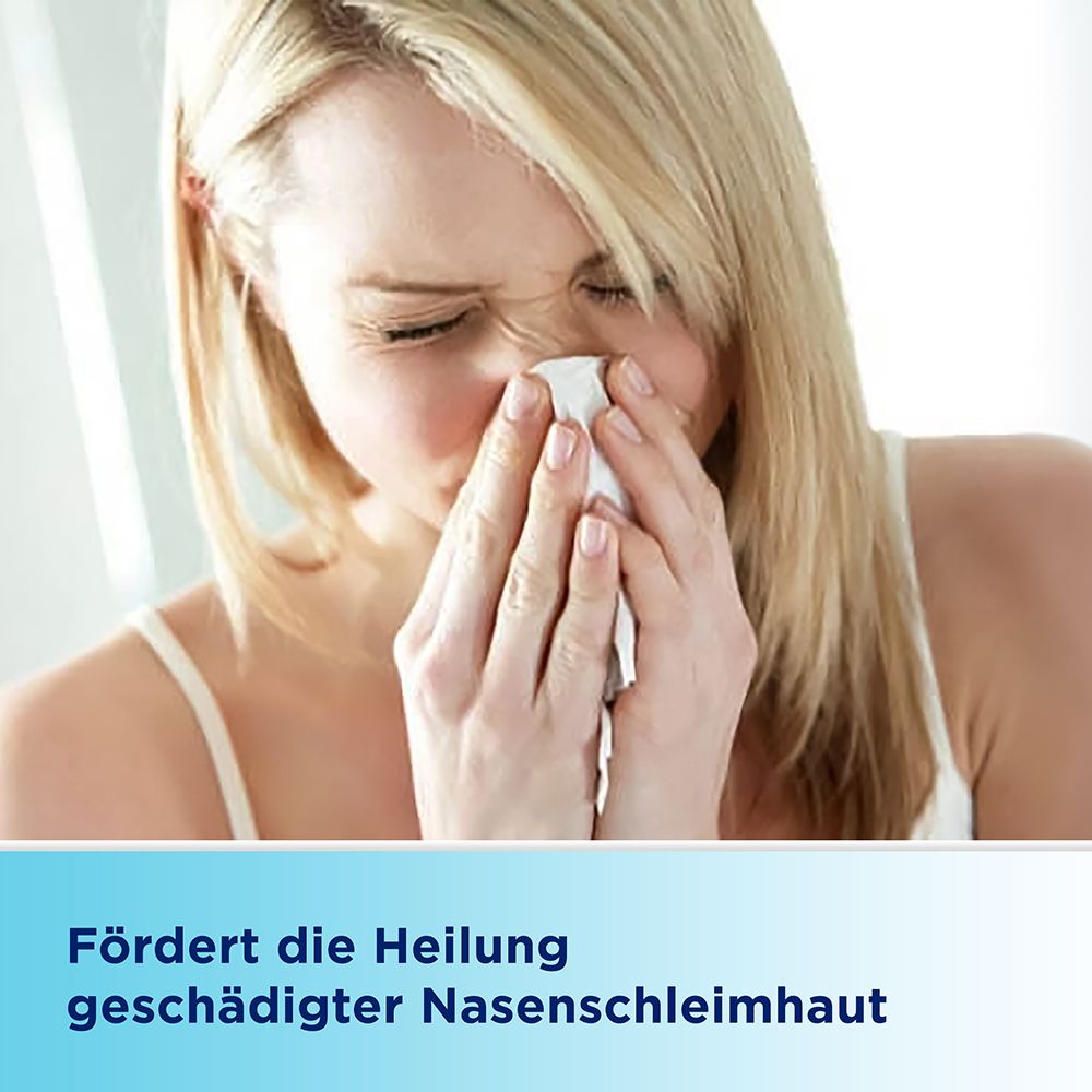 Frau mit Taschentuch an der Nase. Text: Fördert die Heilung geschädigter Nasenschleimhaut.