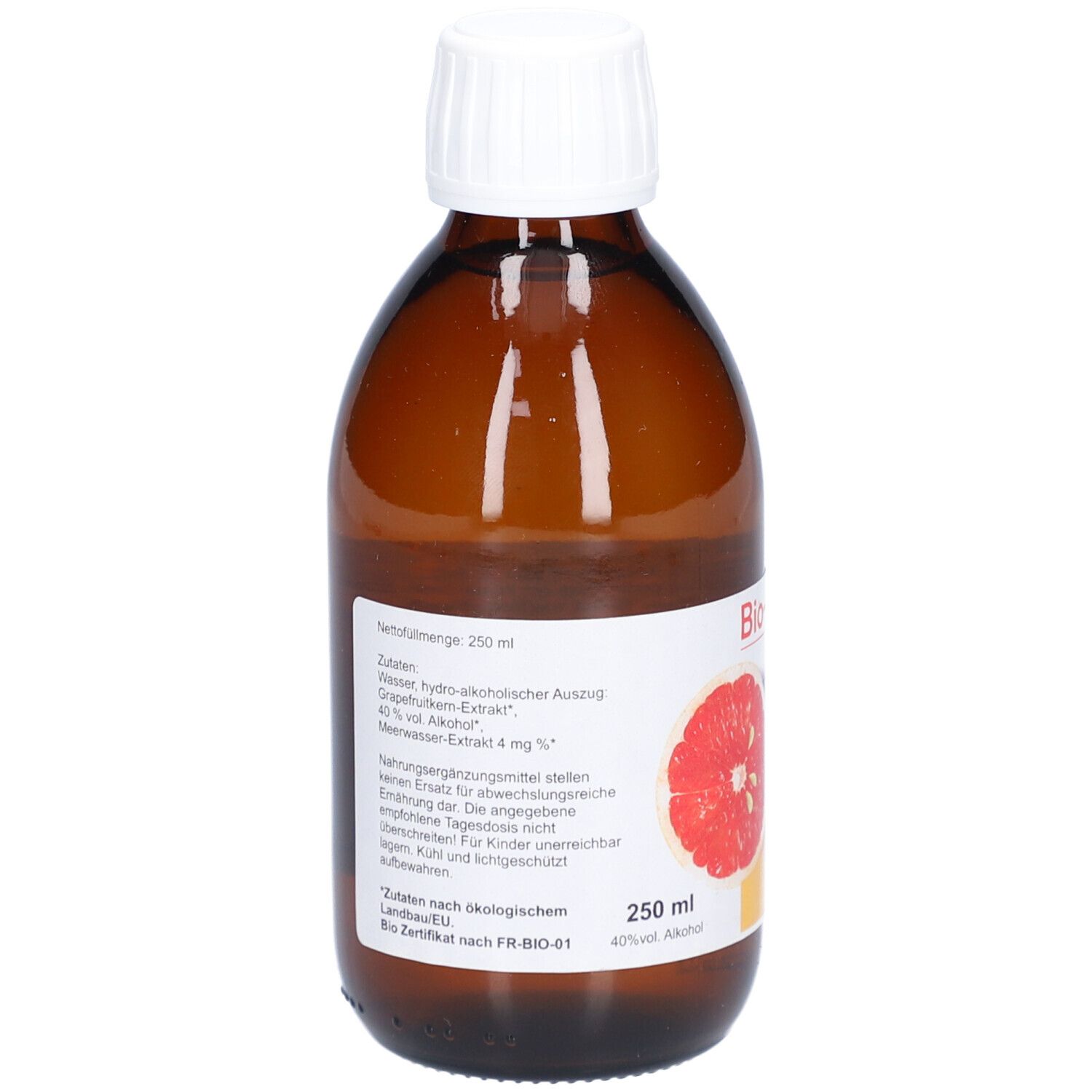 Flacon en verre brun avec bouchon blanc. Étiquette avec informations sur le produit, image de pamplemousse et label bio.