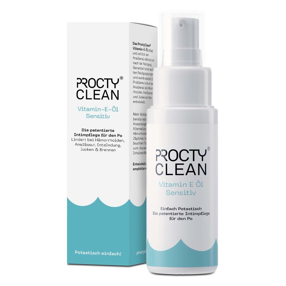 ProctyClean Vitamin-E-Öl Sensitiv. Weiße Flasche mit Sprühkopf und Karton. Blaue und weiße Farbgebung. Text.