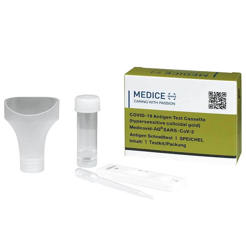 Testkit mit Schachtel, Trichter, Röhrchen und Pipette. Aufschrift Medicovid-AG, Text: COVID-19 Antigen Test Cassette, Speichel.