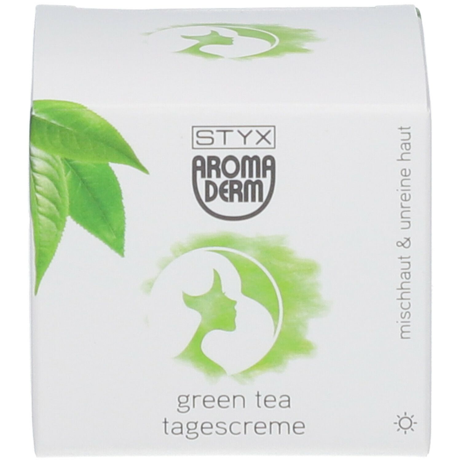 Karton mit Logo, grünen Blättern und Text 'green tea tagescreme'. Text 'mischhaut & unreine haut'.