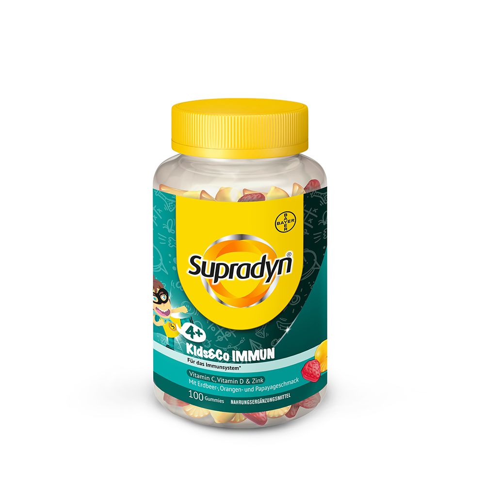 Klare Dose mit gelbem Deckel. Enthält bunte Fruchtgummis. Aufkleber mit "Supradyn Kids&Co IMMUN".