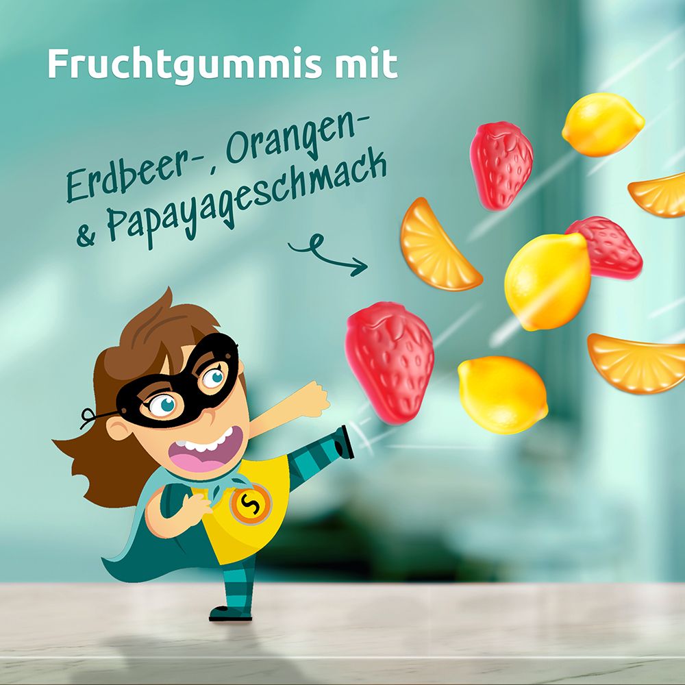 Cartoon-Figur mit Fruchtgummis. Text: "Fruchtgummis mit Erdbeer-, Orangen- & Papayageschmack".
