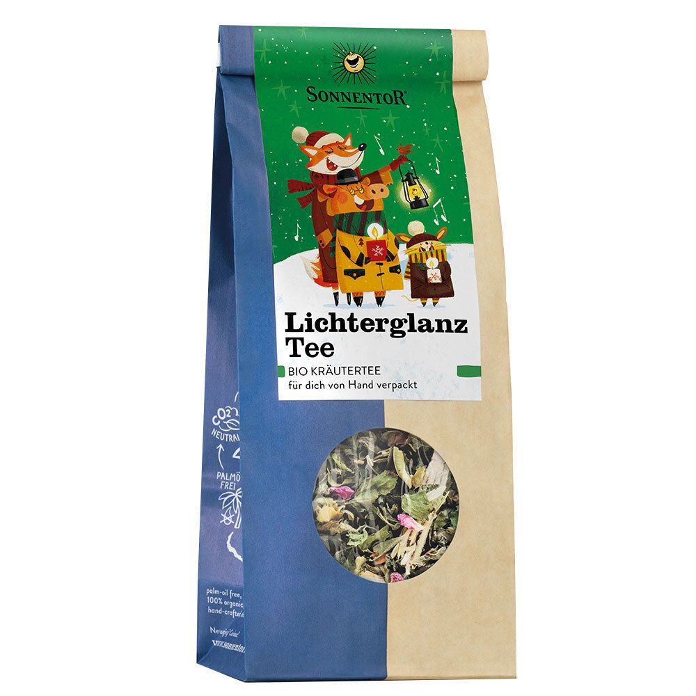 Beutel mit Kräutertee. Sichtfenster zeigt lose Teeblätter. Aufdruck mit Illustration und Schriftzug "Lichterglanz Tee".