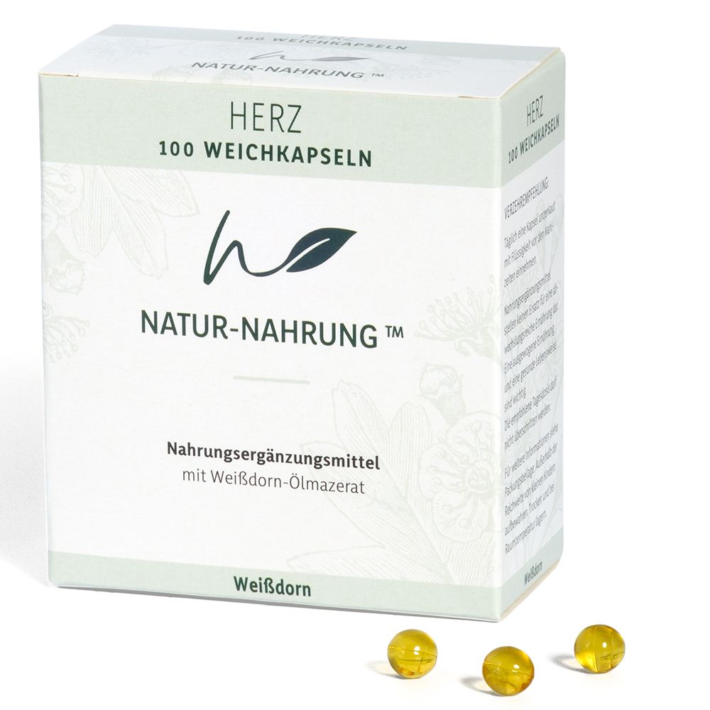 Schachtel mit Kapseln. Aufschrift: NATUR-NAHRUNG Herz, 100 Weichkapseln. Gelbe Kapseln liegen daneben.