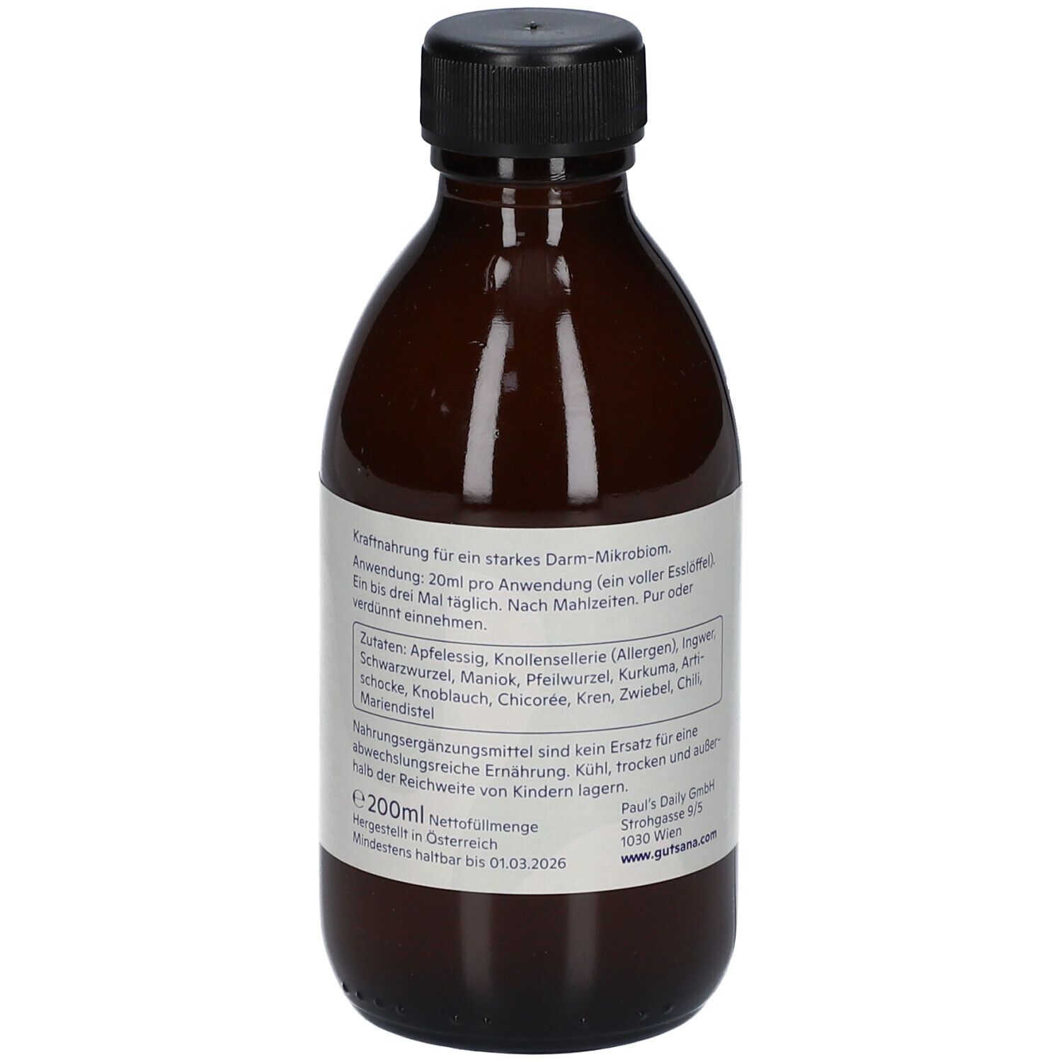 Braune Glasflasche mit schwarzem Deckel. Weißes Etikett mit Text, Zutaten und Mindesthaltbarkeitsdatum.