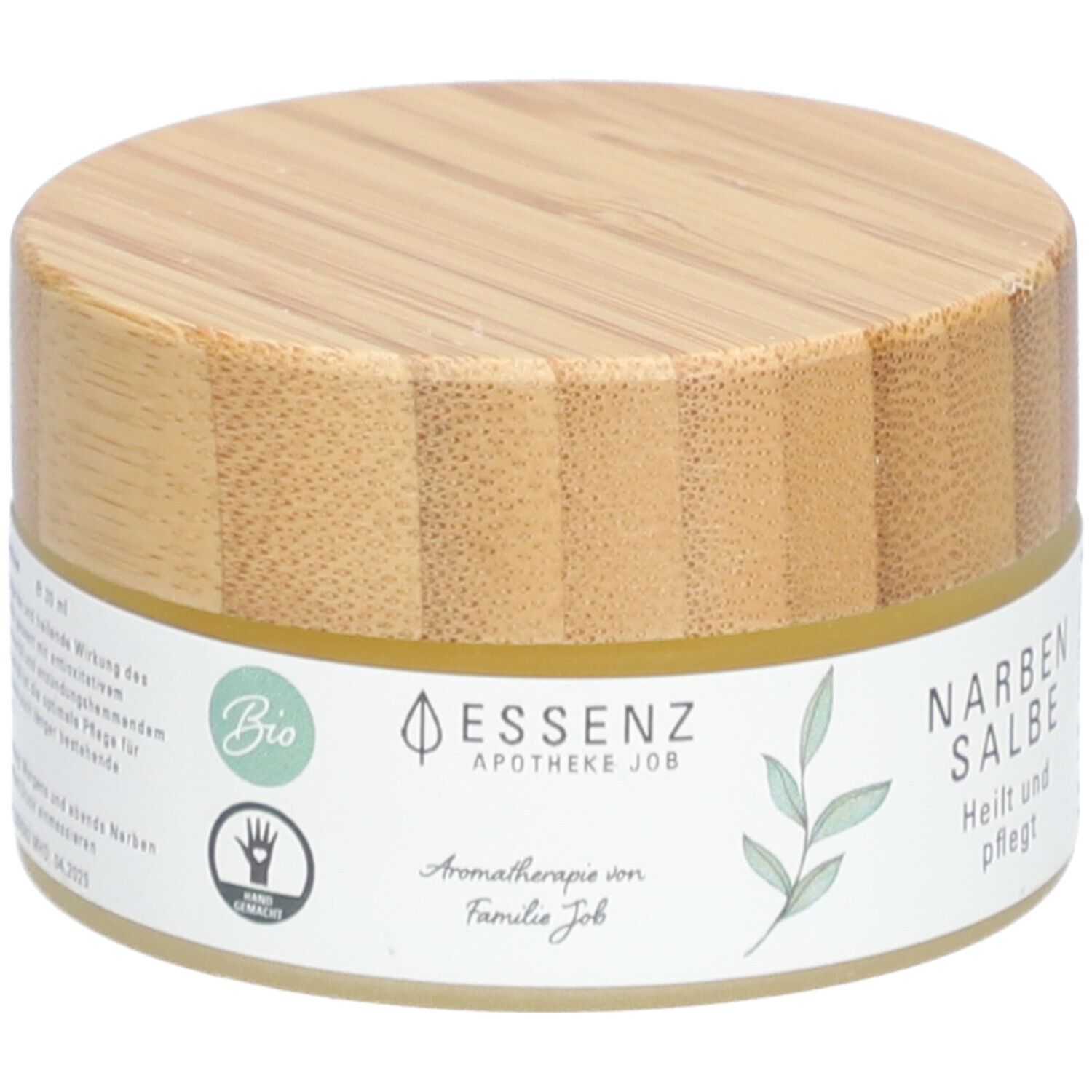 Runde Dose mit Holzdeckel. Aufkleber mit "Essenz Narbensalbe". Bio-Siegel und Hand-Symbol.