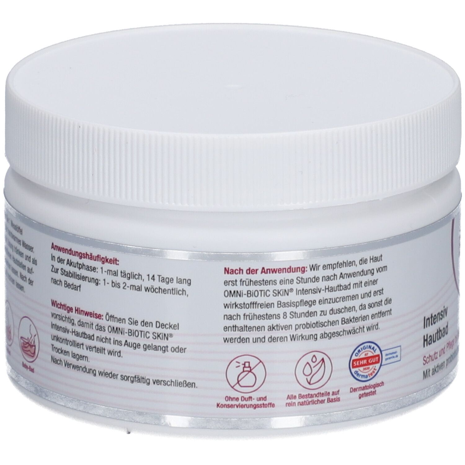 Weißer Tiegel mit Schraubverschluss. Aufschrift OMNi-BiOTiC SKIN Intensiv-Hautbad. Rückseite mit Text und Logos.