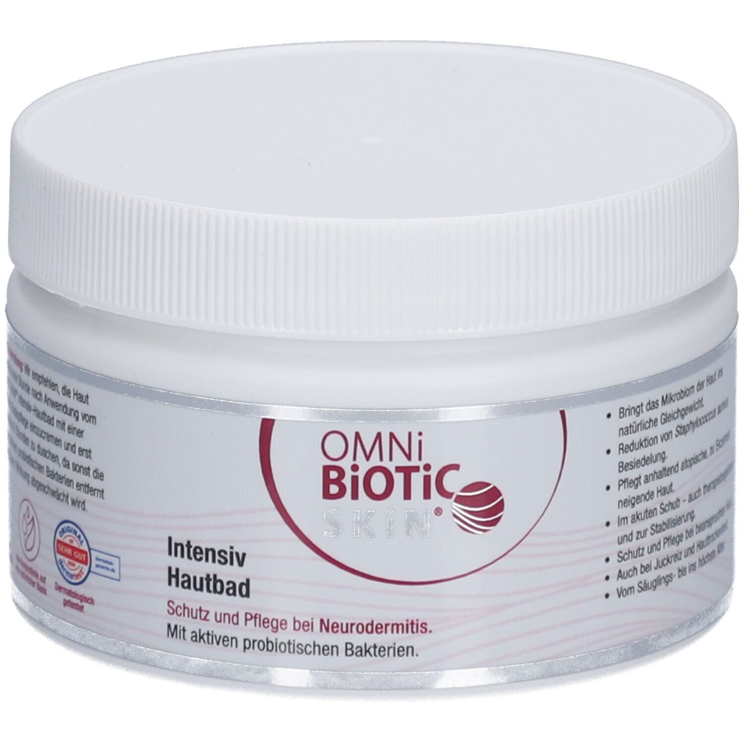 Weißer Tiegel mit Schraubverschluss. Aufschrift OMNi-BiOTiC SKIN Intensiv-Hautbad. Rückseite mit Text und Logos.