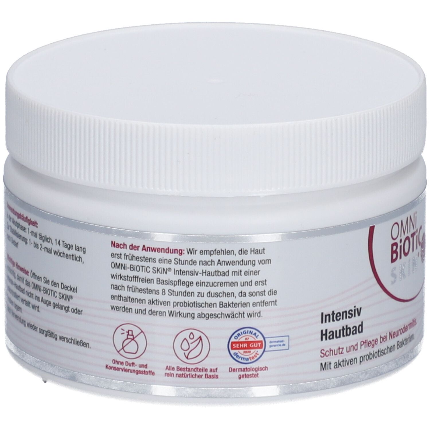 Weißer Tiegel mit Schraubverschluss. Aufschrift OMNi-BiOTiC SKIN Intensiv-Hautbad. Rückseite mit Text und Logos.