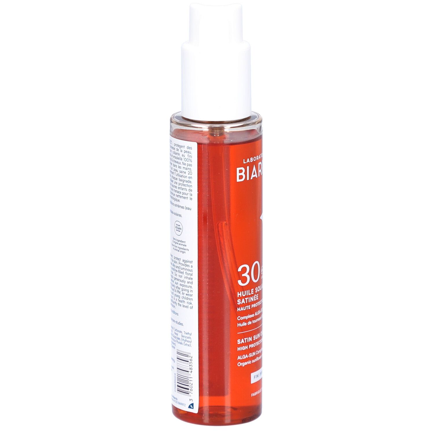 Sonnenschutzöl von Laboratoires de Biarritz. Transparente Flasche mit weißem Pumpkopf. Rückseite mit Text und Etikett. Rote Flüssigkeit sichtbar.