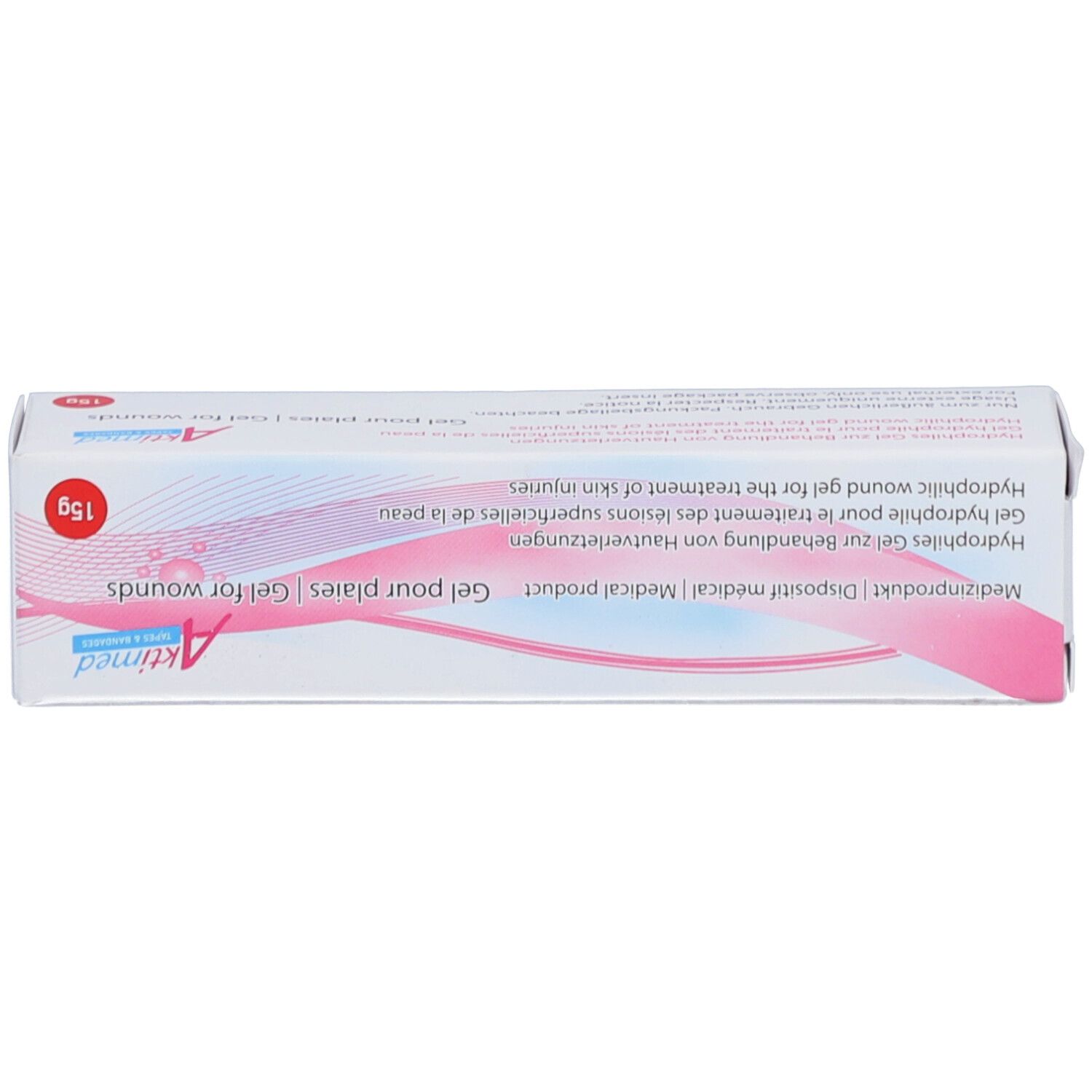 Oberseite der Wundgel-Schachtel. Aufschrift: Wundgel, Aktimed. 15g. Gel für Wunden. Medizinprodukt. Weiß-rosa Design.