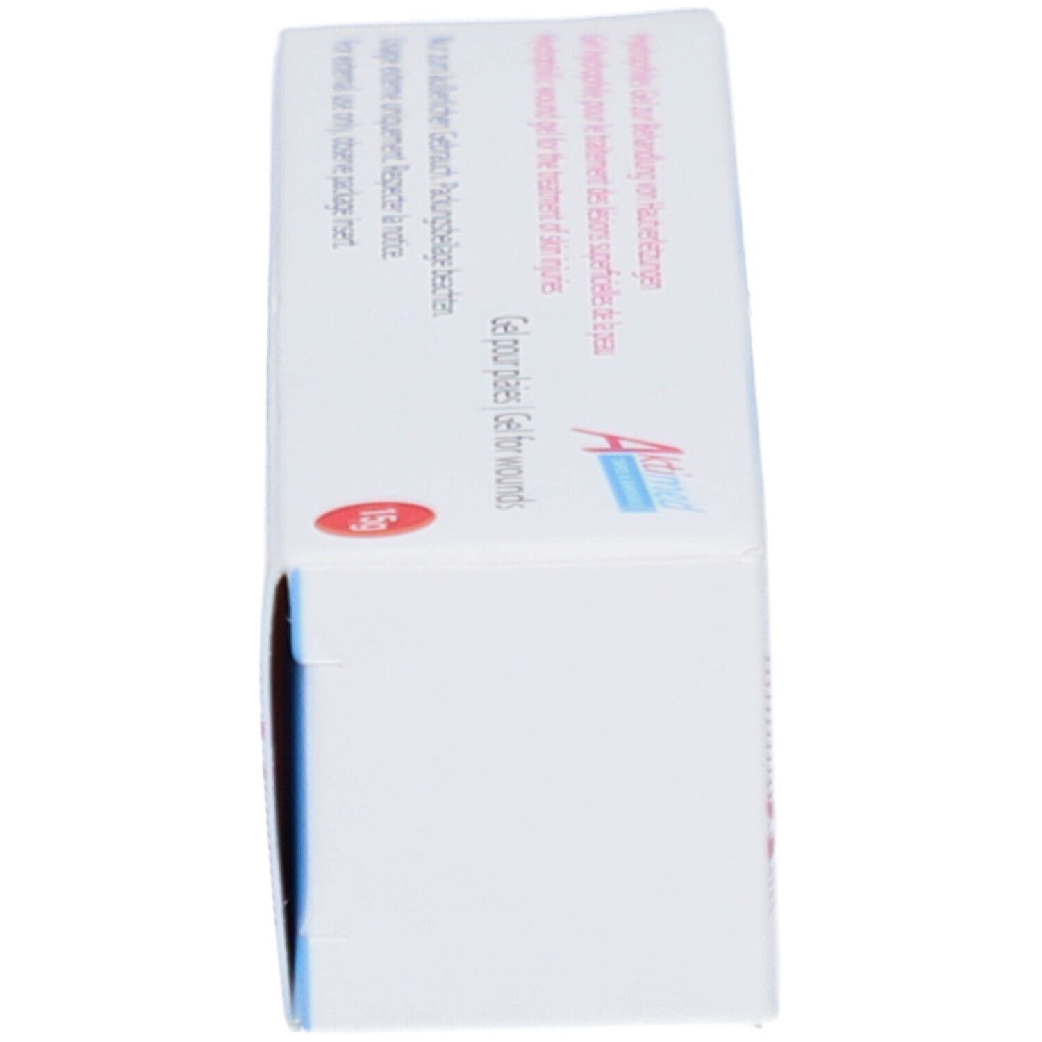 Seitenansicht der Wundgel-Schachtel. Aufschrift: Aktimed. Gel für Wunden. Medizinprodukt. Weiß-rosa Design.