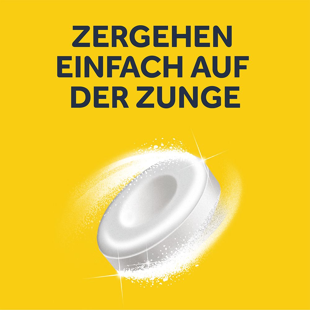 Nahaufnahme einer weißen, runden Schmelztablette. Text: Zergehen einfach auf der Zunge. Gelber Hintergrund mit weißen, sternförmigen Lichteffekten.