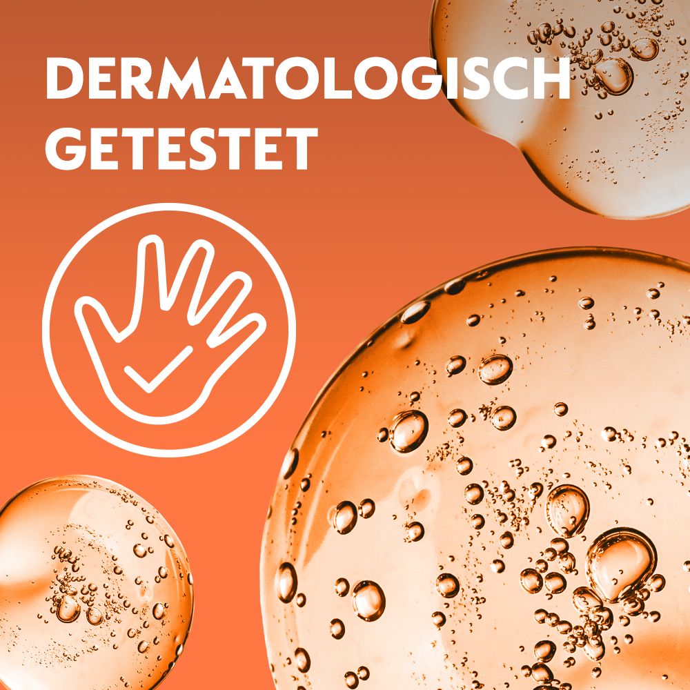 Nahaufnahme von Seifenblasen. Text: Dermatologisch getestet. Hand-Symbol mit Häkchen.