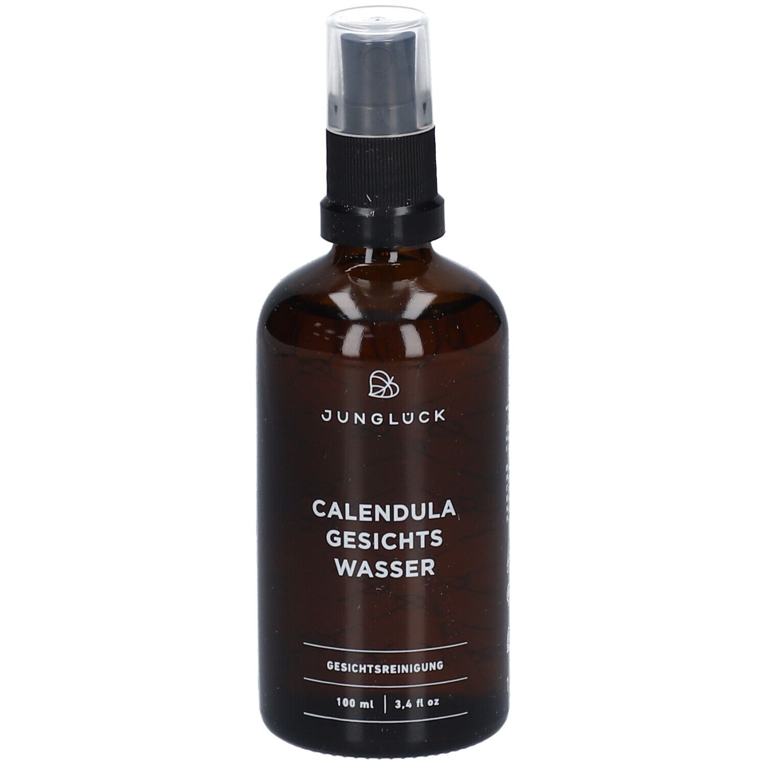 Braune Glasflasche mit Sprühkopf. Aufschrift: JUNGLÜCK CALENDULA GESICHTS WASSER. Gesichtsreinigung.