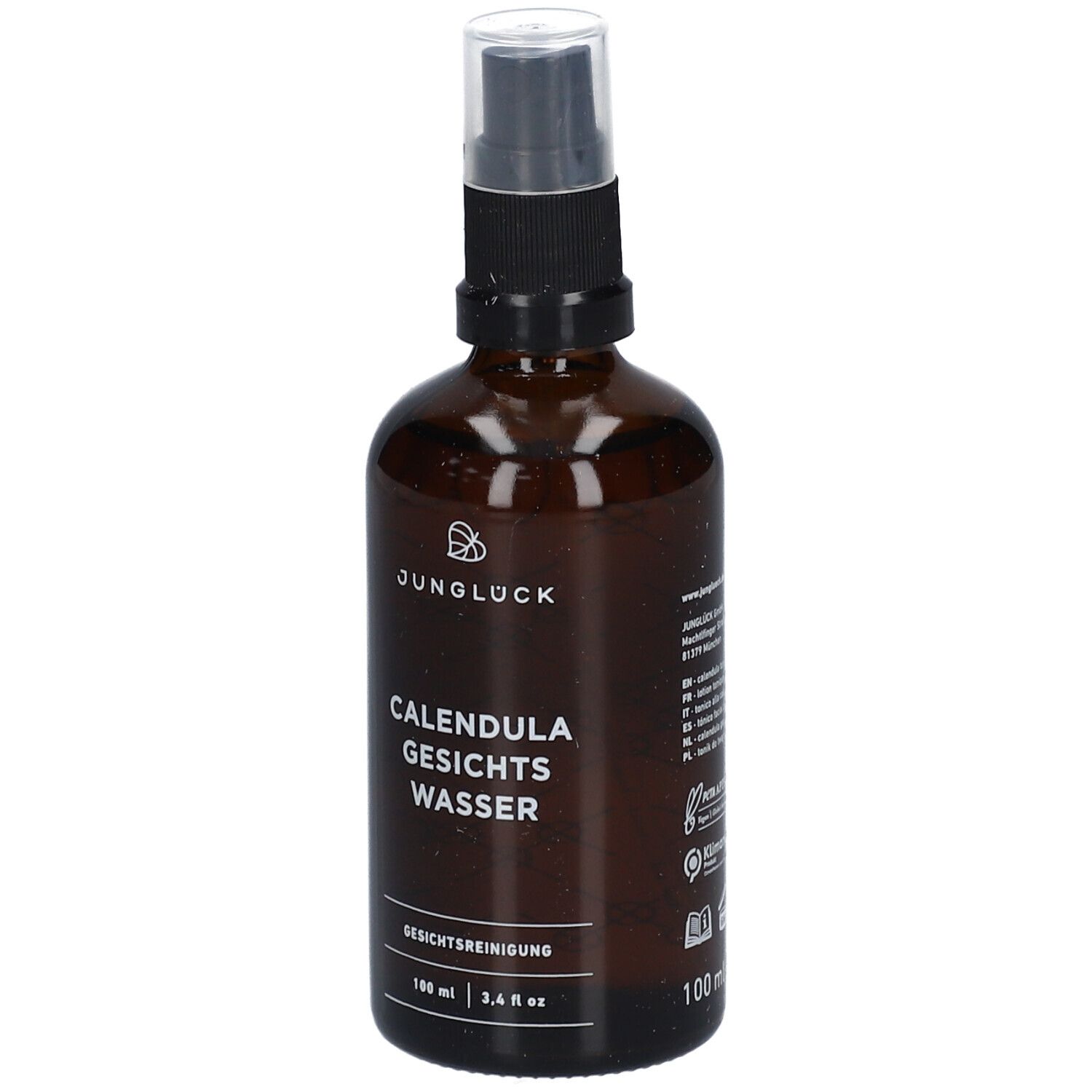 Braune Glasflasche mit Sprühkopf. Aufschrift: JUNGLÜCK, CALENDULA GESICHTS WASSER. Gesichtsreinigung.