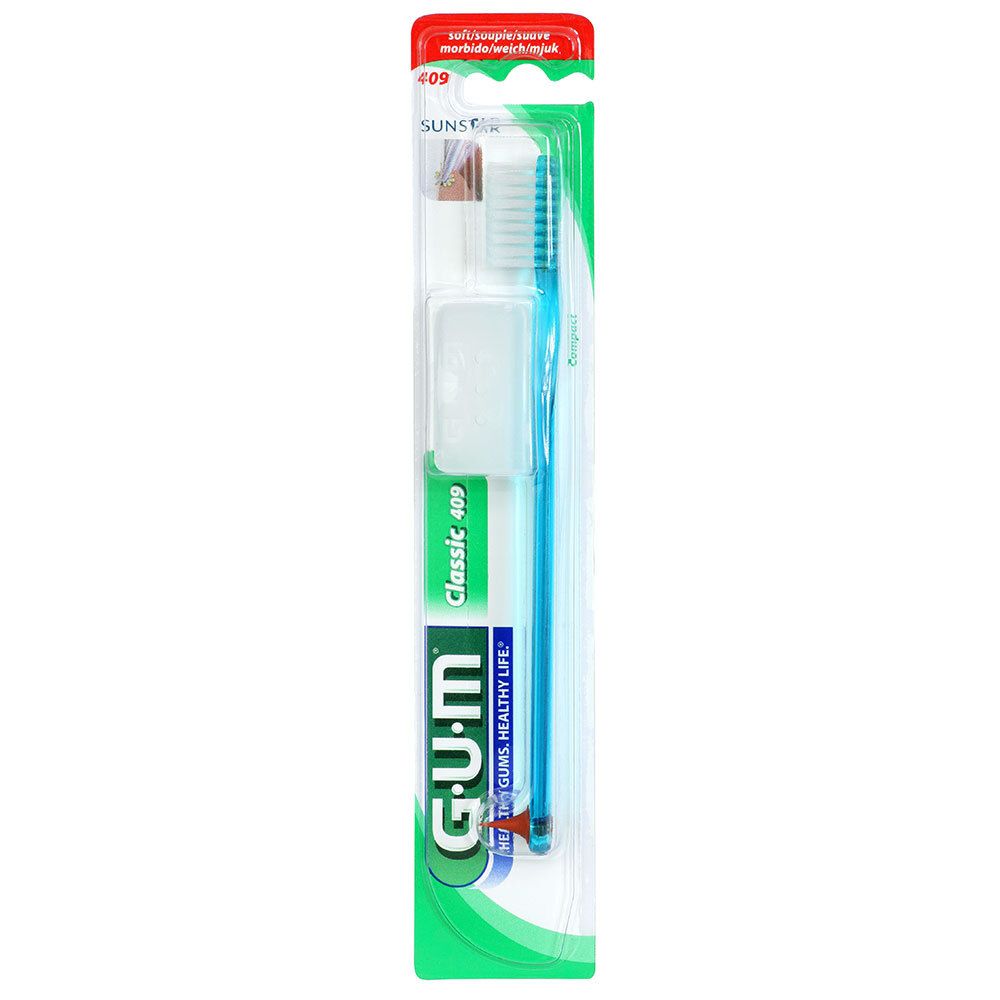 Brosse à dents en blister. Manche bleu, tête blanche. Marque G.U.M. Classic 409.