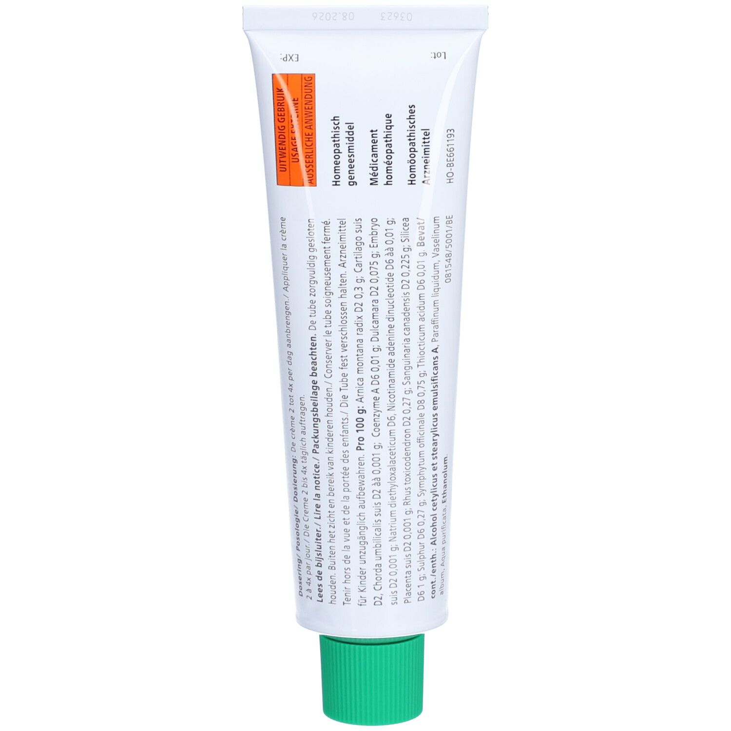 Dos du tube de crème. Contient des informations et des ingrédients. Autocollant orange avec texte.