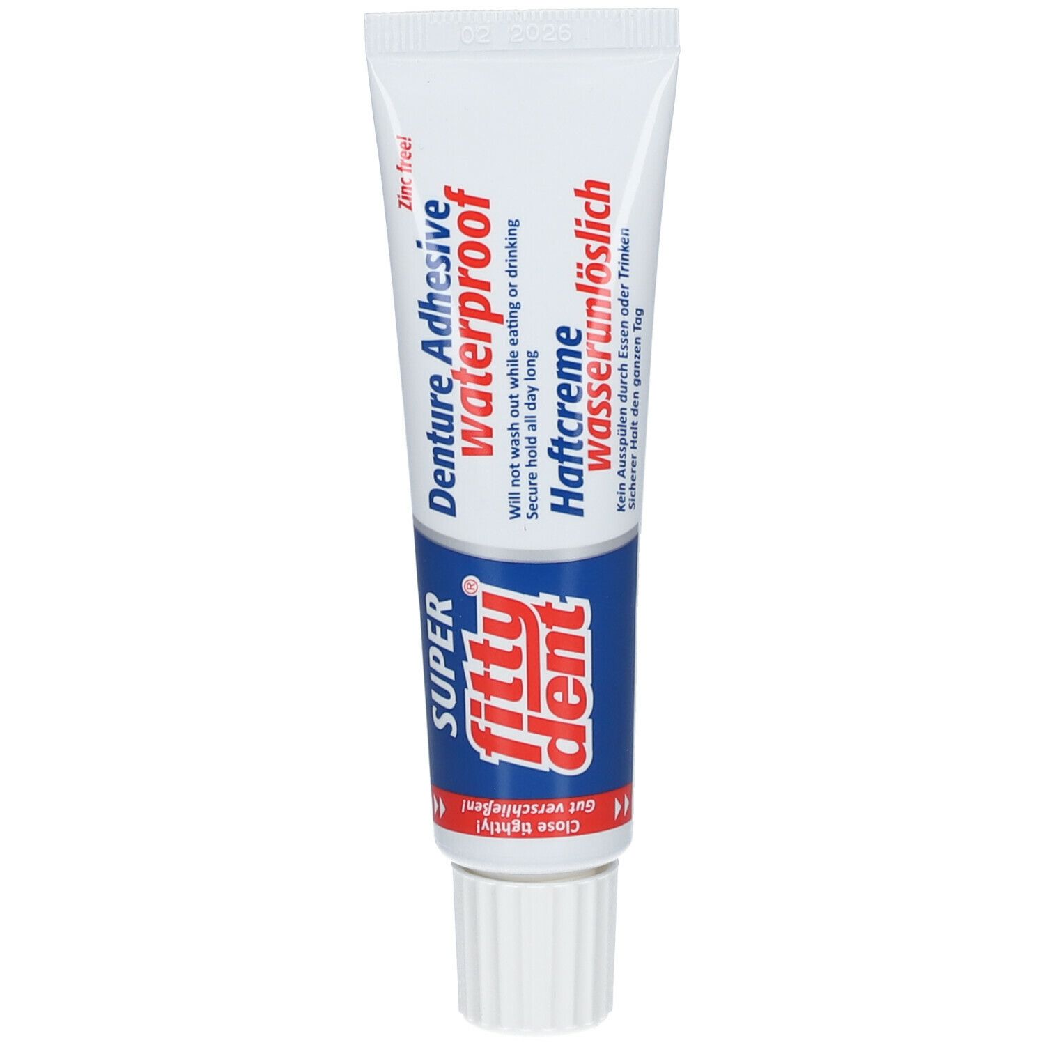 Tandpastatube met "fittydent super". Opschriften: "Denture Adhesive waterproof" en "Haftcreme wasserunlöslich".