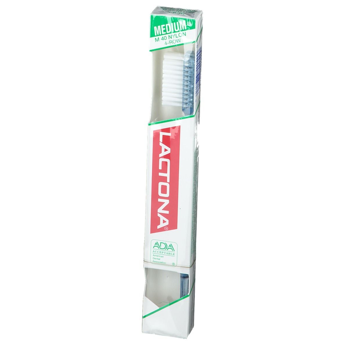 Brosse à dents dans son emballage. Marque Lactona, logo rouge. Emballage avec accent vert. Sceau ADA.