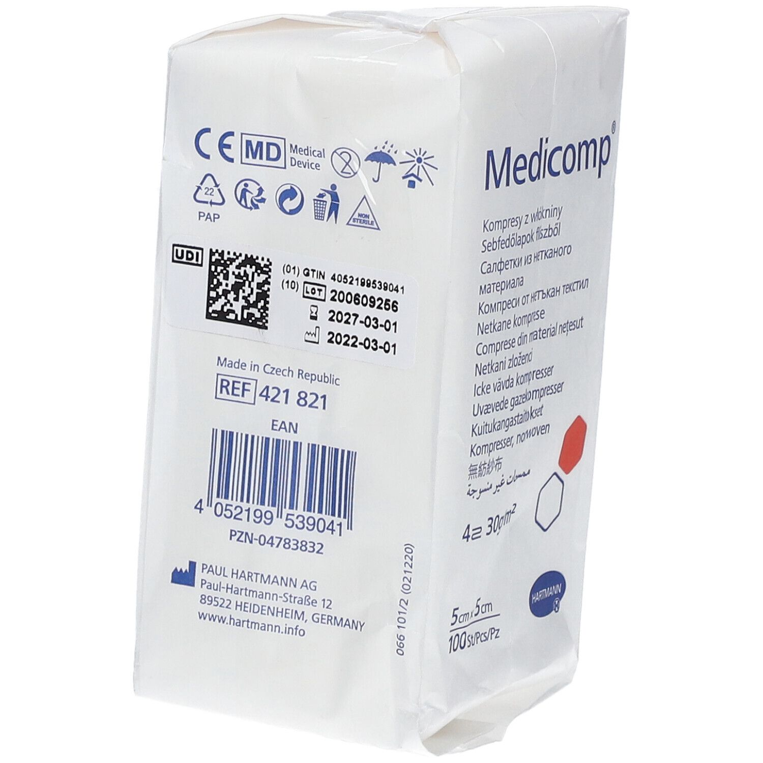 Dos de l'emballage des compresses Medicomp. Dispositif médical. Numéro de lot, date de péremption. Informations fabricant. Code EAN.
