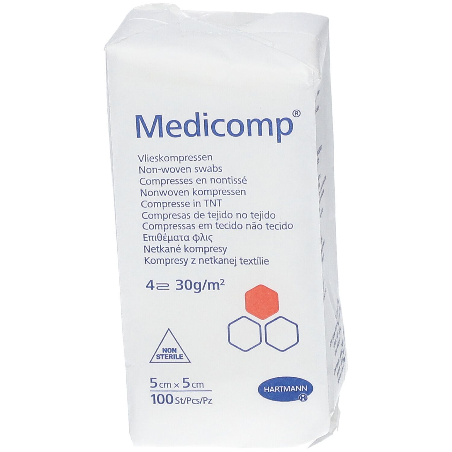 Emballage de compresses Medicomp. 5x5cm, 100 pièces. Compresses non tissées. Logo Hartmann. Inscriptions multilingues. Non stérile.