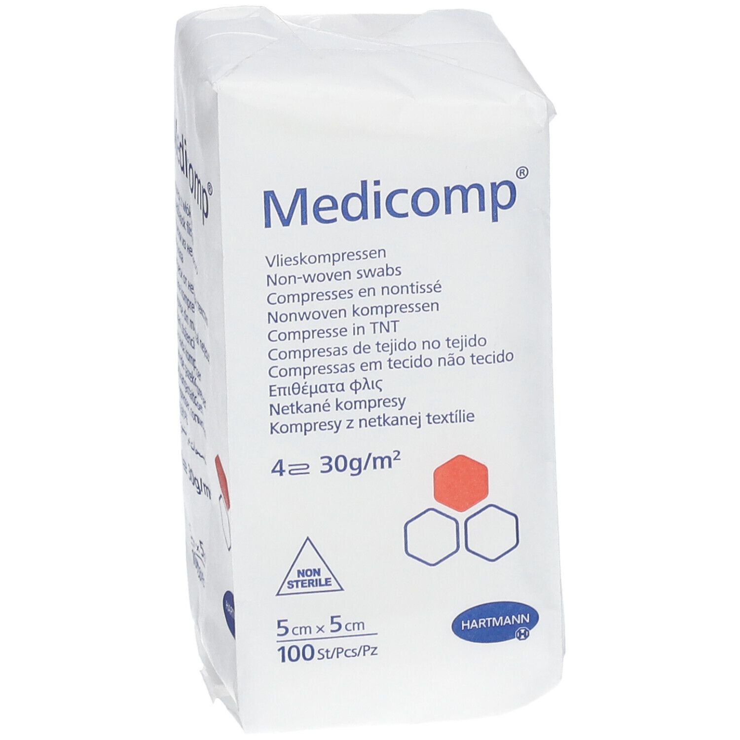 Emballage de compresses Medicomp. 5x5cm, 100 pièces. Compresses non tissées. Logo Hartmann. Inscriptions multilingues. Non stérile.