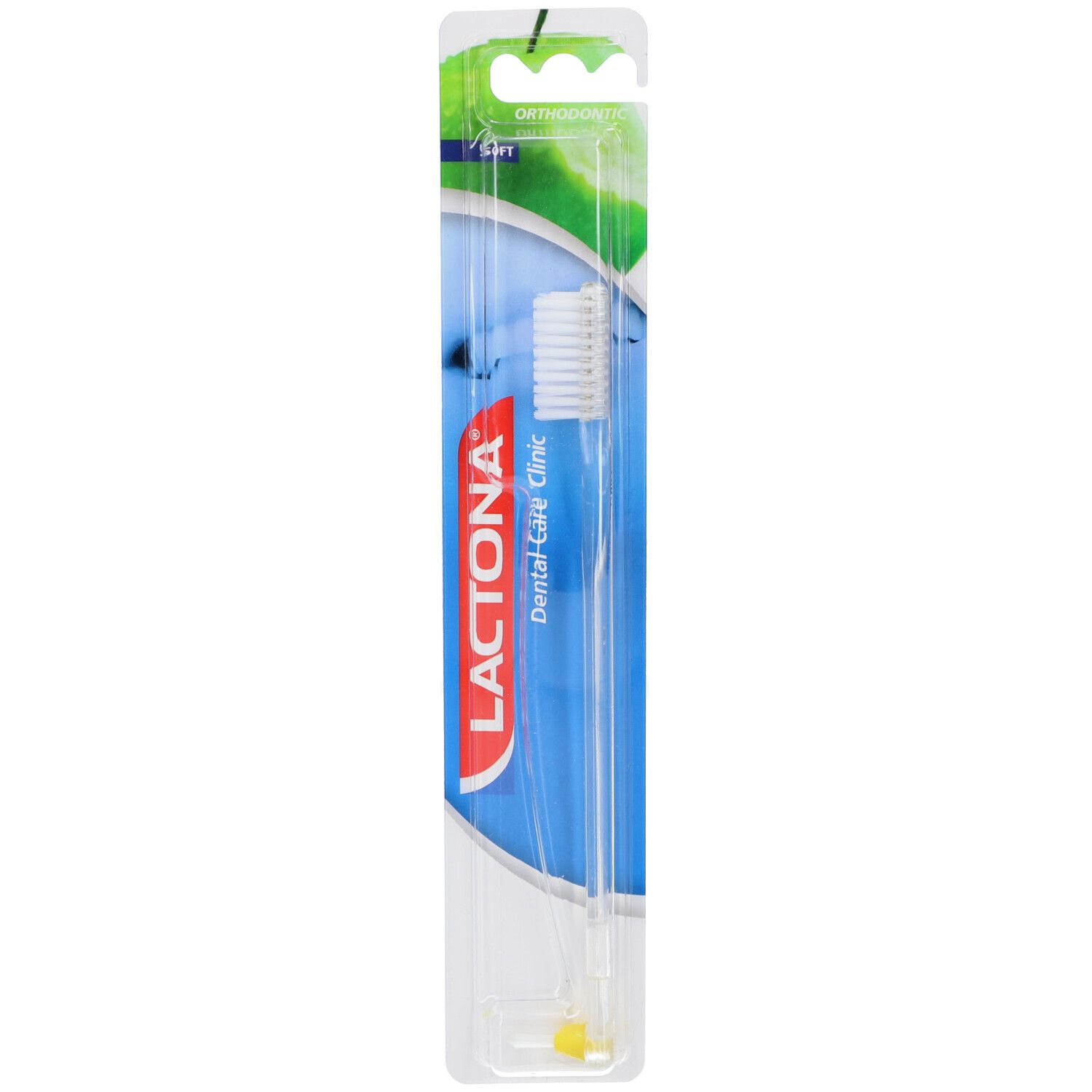 Zahnbürste in Blisterverpackung. Transparenter Griff, weißer Bürstenkopf. Aufschrift: Lactona Dental Care Clinic. Gelber Punkt am Griff.