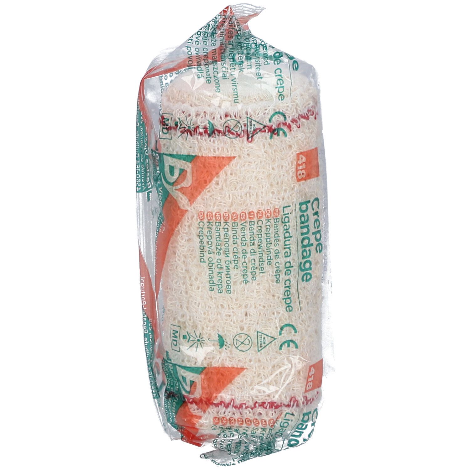 Verbandrolle in transparenter Verpackung. Aufdruck: Crepe Bandage, Ligadura de crepe. Rotes Filet. CE-Zeichen.