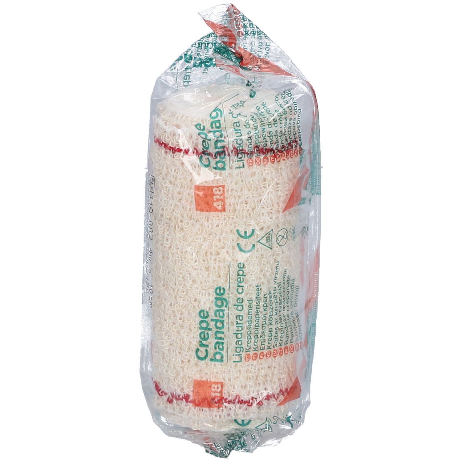 Verbandrolle in transparenter Verpackung. Aufdruck: Crepe Bandage, Ligadura de crepe. Rotes Filet. CE-Zeichen.