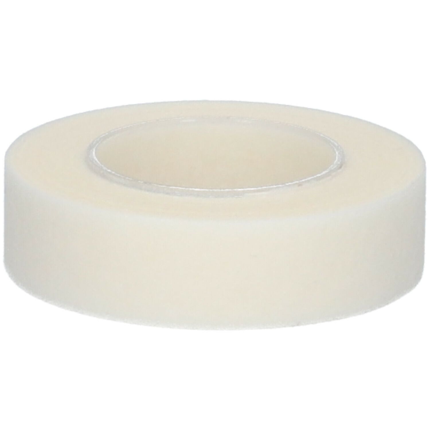 Rouleau de ruban adhésif hypoallergénique. Ruban blanc, cylindrique. Noyau visible.