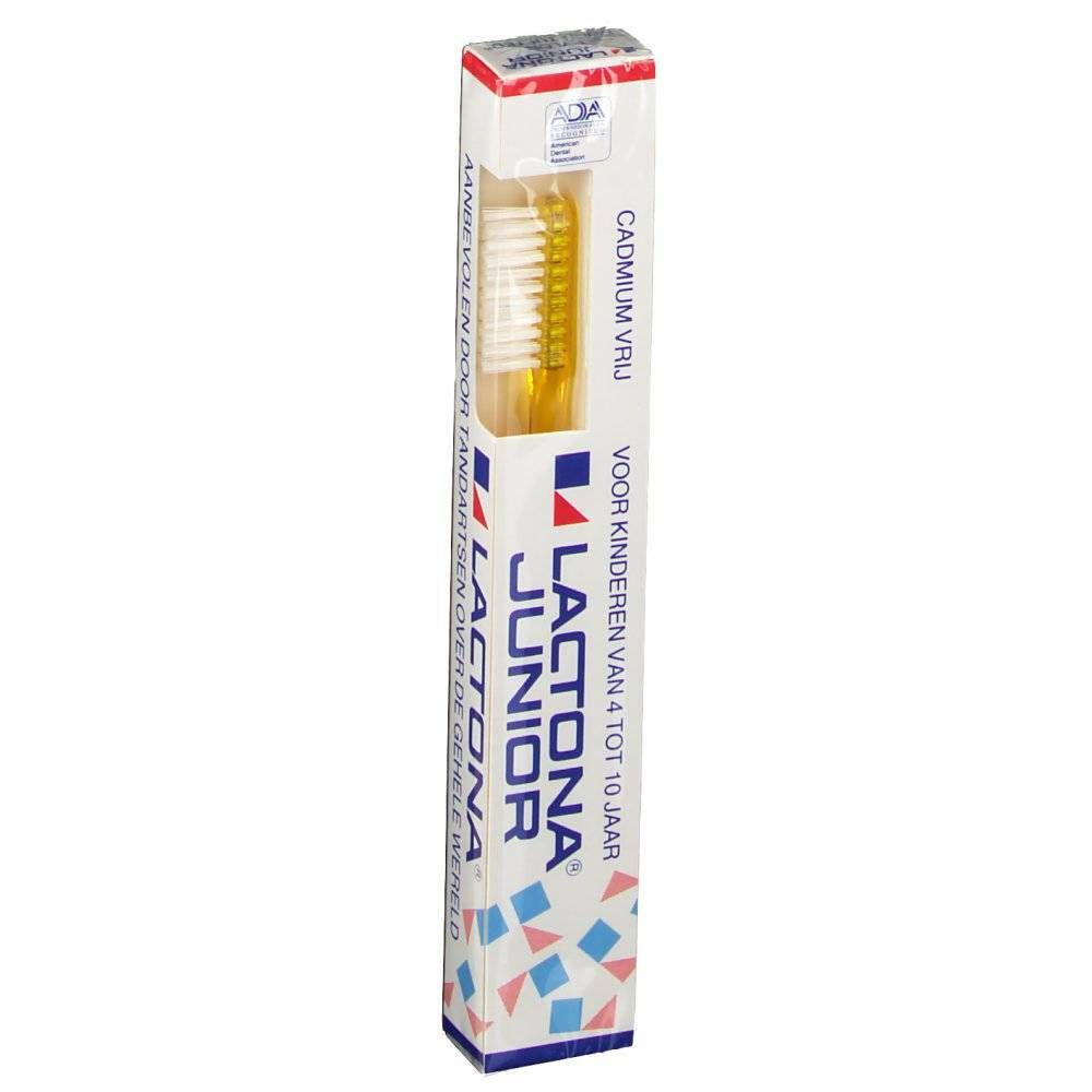 Brosse à dents dans son emballage. Tête jaune, manche transparent. Emballage avec logo et texte.