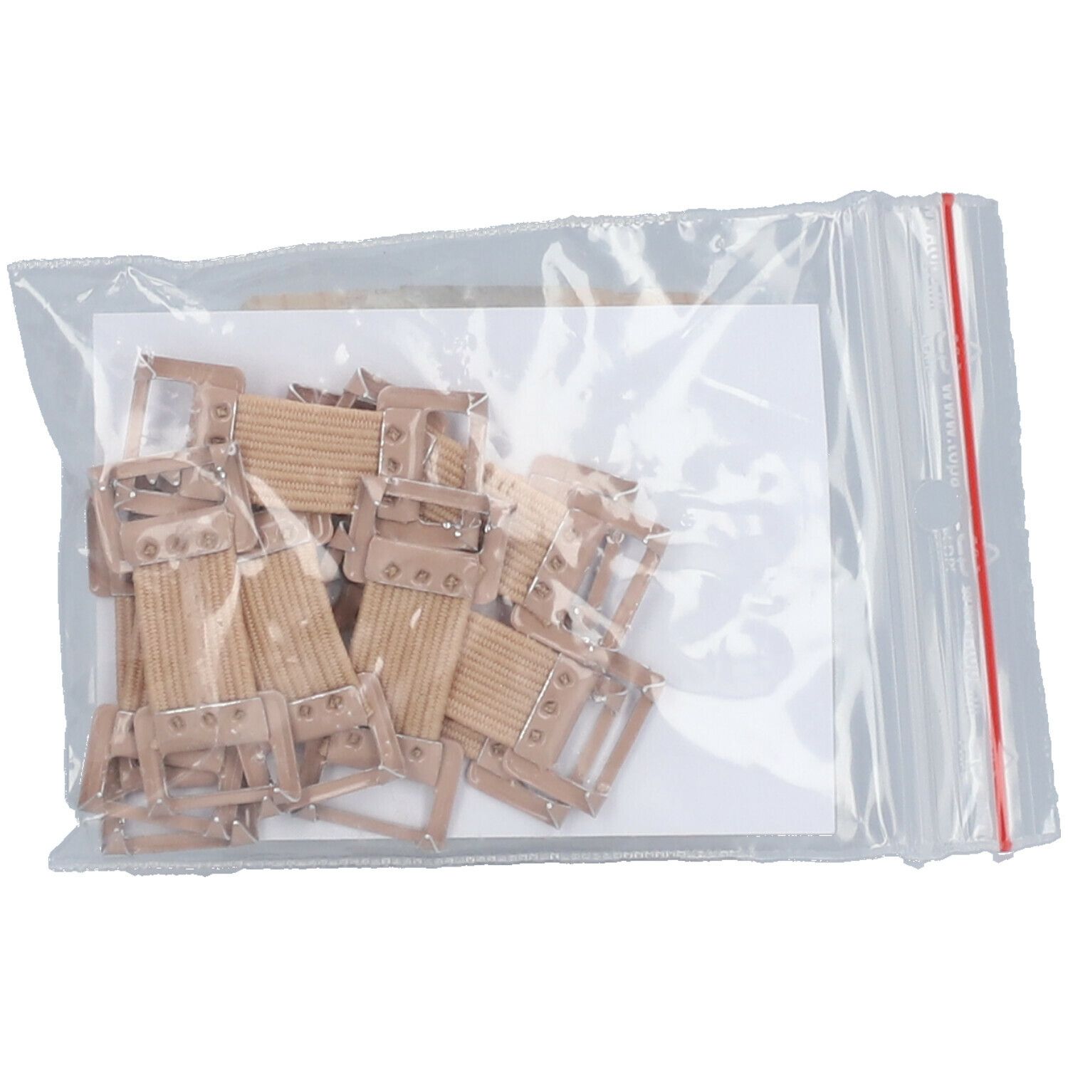 Sachet transparent avec crochets de bandage marron. Plusieurs crochets sur papier blanc.