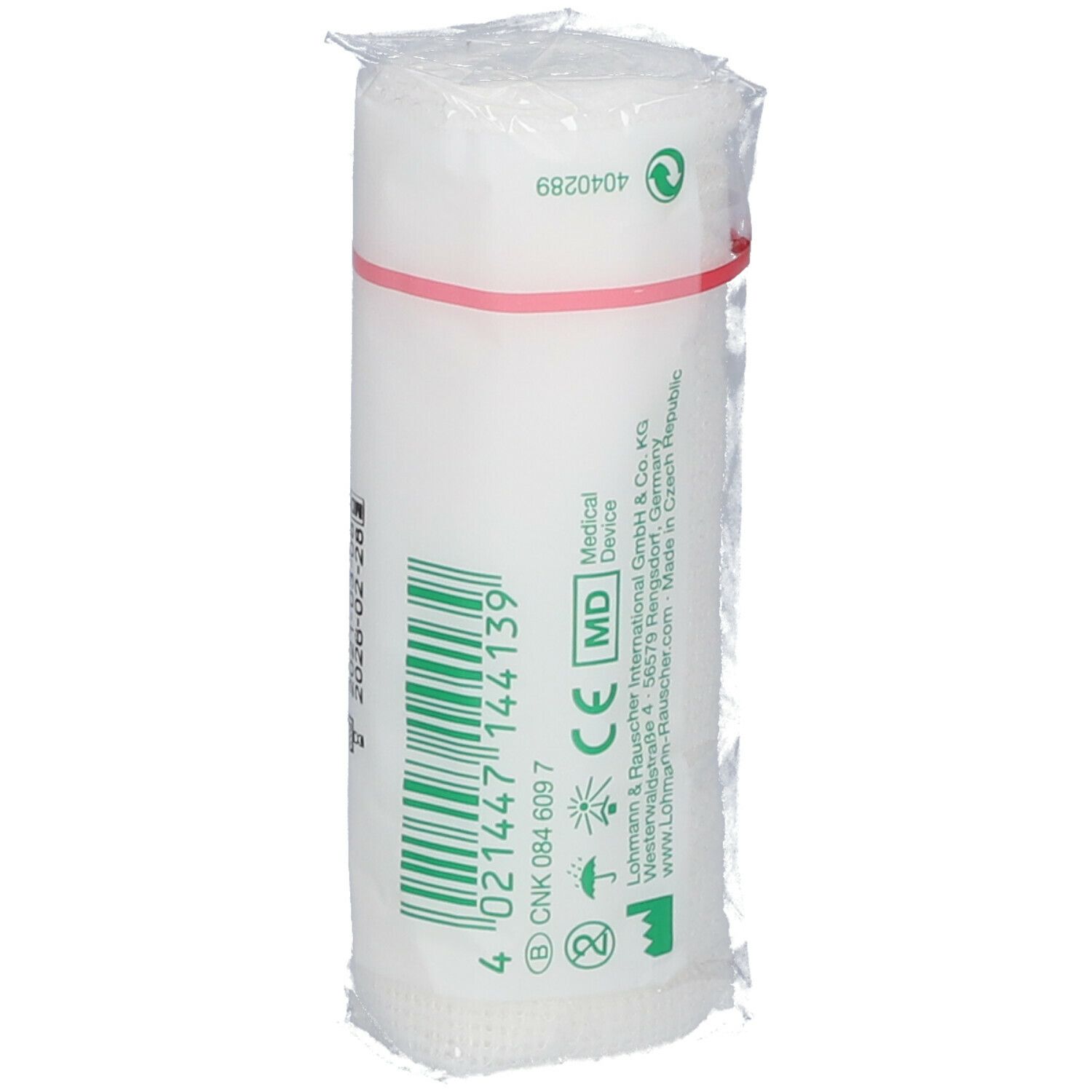 Bande de fixation élastique blanche, emballée dans du film plastique. Bande rouge. Inscriptions : MD, marquage CE, numéro de lot, date de péremption.