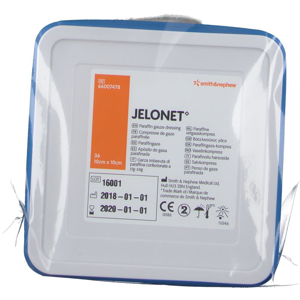 Emballage de compresse de gaze JELONET. Forme carrée, bordure bleue. Texte : 10 cm x 10 cm, logo Smith & Nephew.