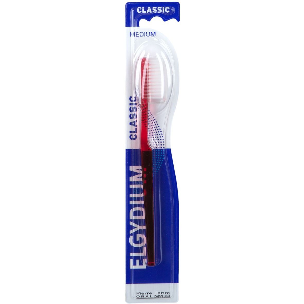 Brosse à dents Elgydium Classic Medium, rouge et bleu. Emballage blister. Nom de la marque et du produit visibles.