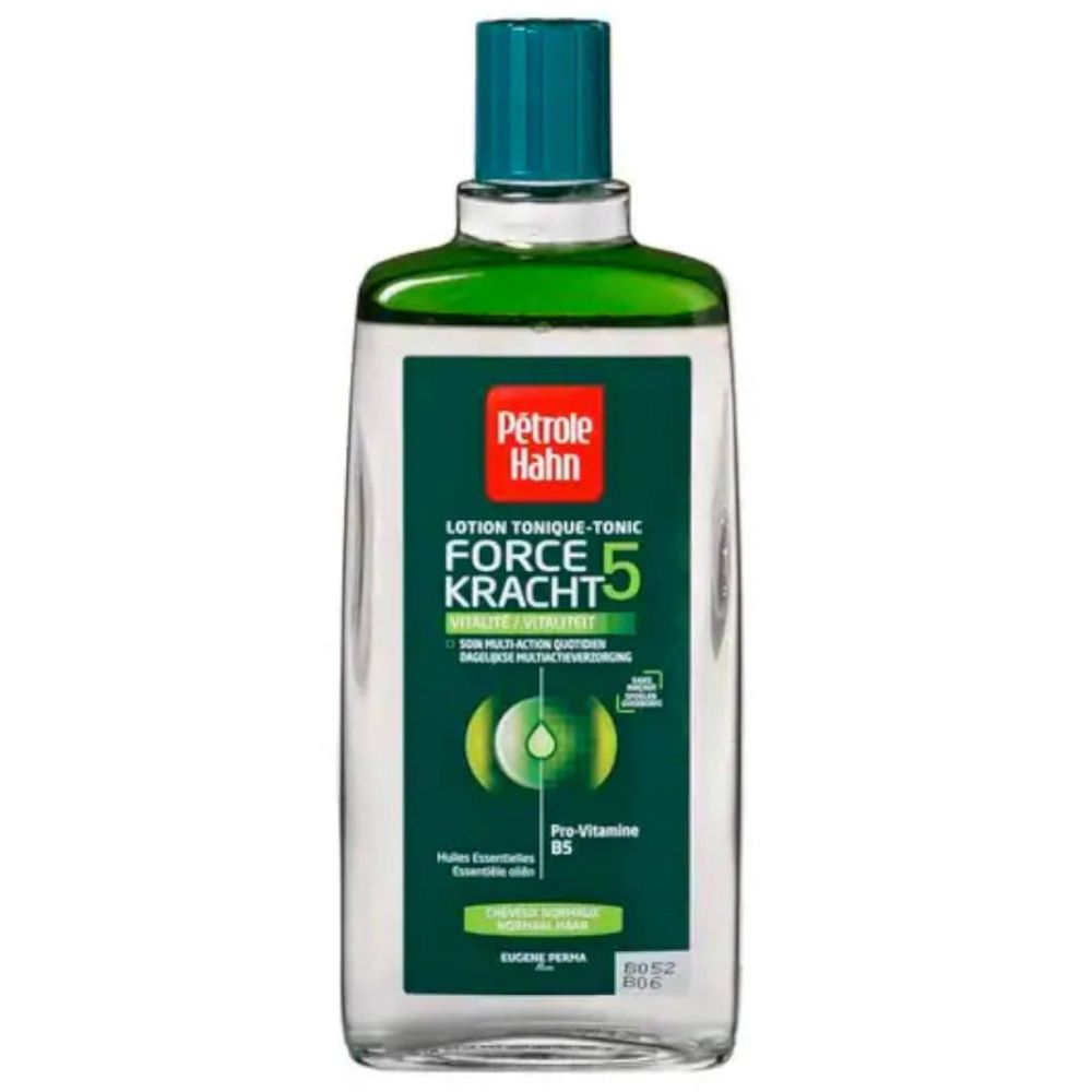 Transparante fles met groene dop en etiket. Opschrift: Petrole Hahn, Lotion Tonique-Tonic, Force Kracht 5.