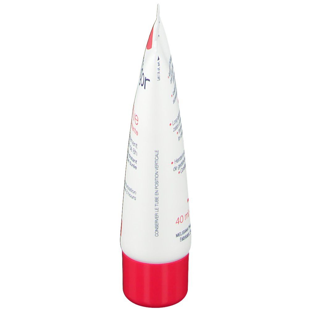 Vue latérale du tube de crème. Blanc et rouge. Texte en français.