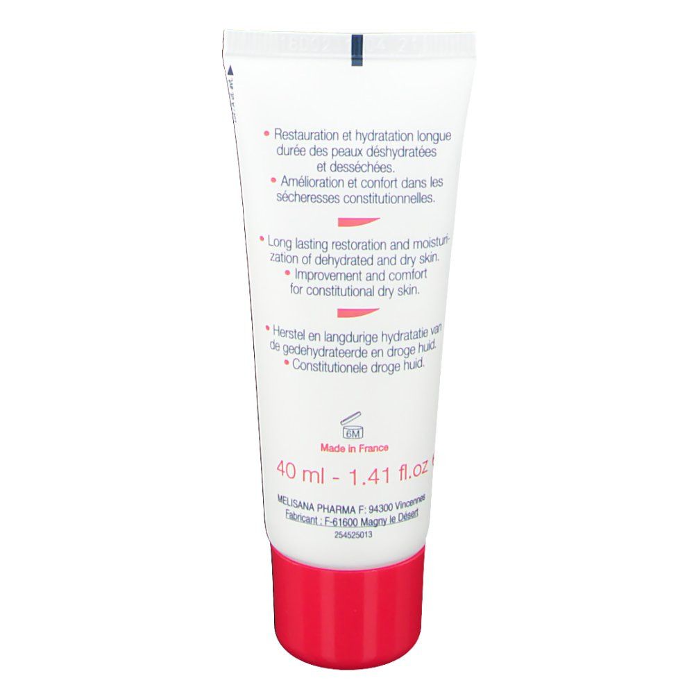 Dos du tube de crème. Blanc et rouge. Texte en français et anglais.