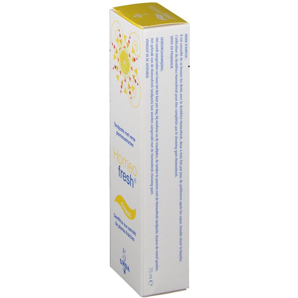 Boîte de dentifrice. Inscription Homeofresh Citrus. Logo jaune. Marque UNDA. Texte multilingue.